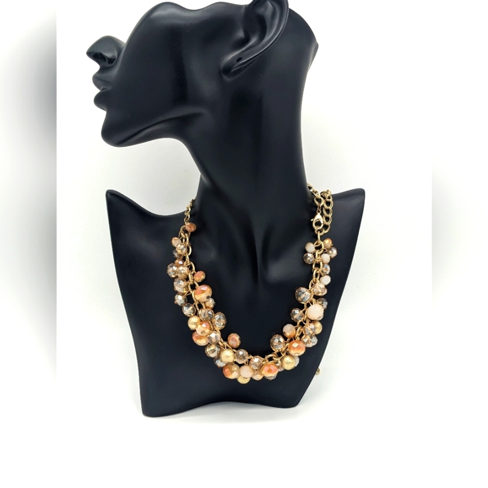 Vintage The Loft antique gold tone chains and an iridescent smoky oran cut glass